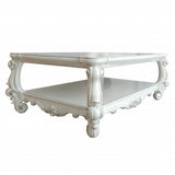 57" Antiqued White Solid And Manufactured Wood Coffee Table With Shelf