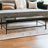 54" Clear And Black Glass And Steel Coffee Table With Shelf