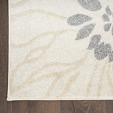 5' x 7' Cream Floral Power Loom Distressed Area Rug