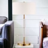 25" Gold and White Metal Two Light Table Lamp With White Drum Shade