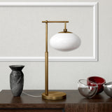 25" Brass Metal Arched Table Lamp With Clear Seeded Globe Shade